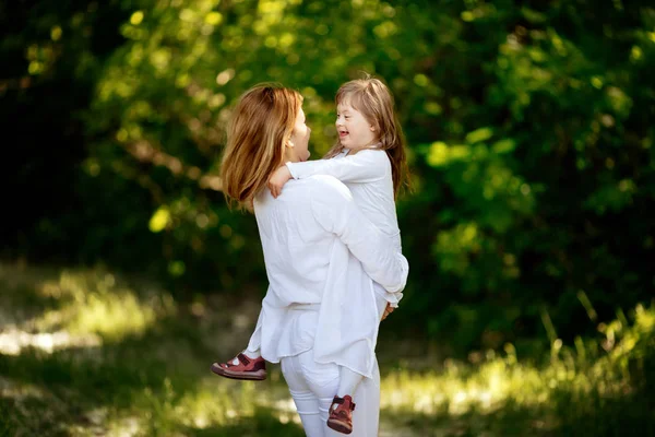 Baby with down sydrome enjoying outdoor play — Stock Photo, Image