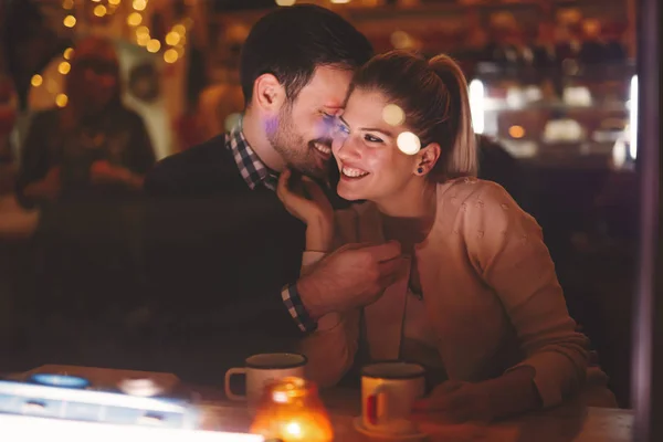 Couple dating at night in pub — Stock Photo, Image