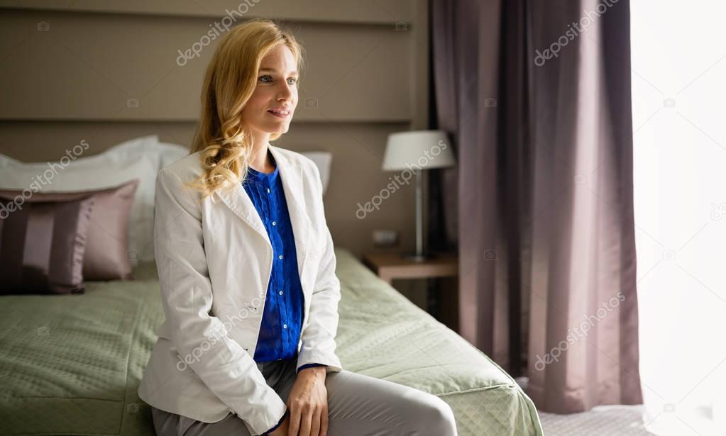 Blond woman in hotel room 