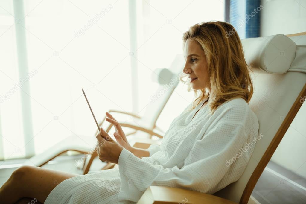 Beautiful woman relaxing in spa center