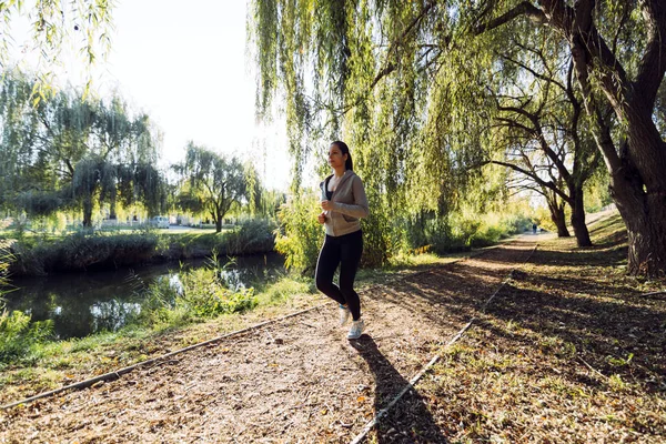 Fit female jogger running