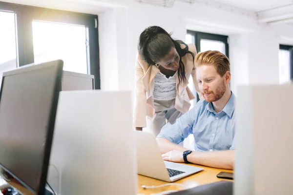 Supervising colleague during work — Stock Photo, Image