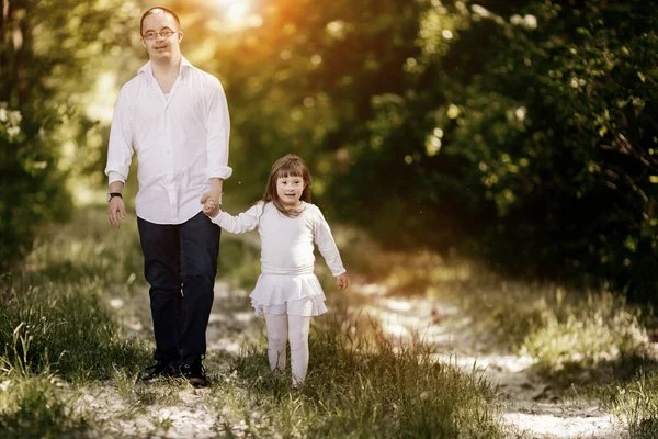 People with down sydrome walking in forest — Stock Photo, Image