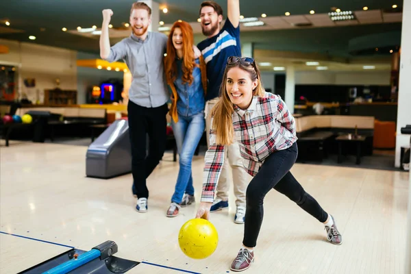 Friends having great time playing bowling — Stock Photo, Image