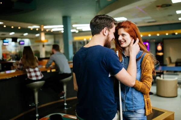 Couple hugging in snooker bar — Stock Photo, Image