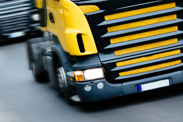 Trucks being driven on road — Stock Photo, Image