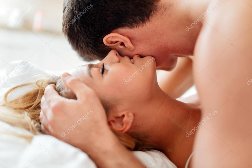 Happy couple in bedroom