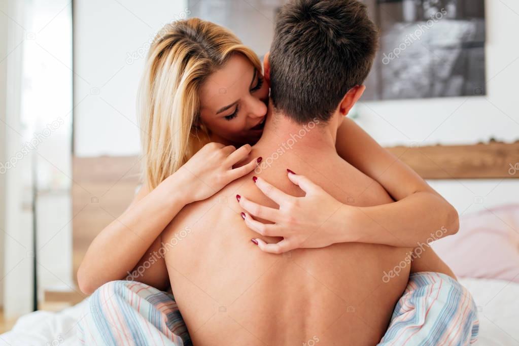 Happy couple in bedroom