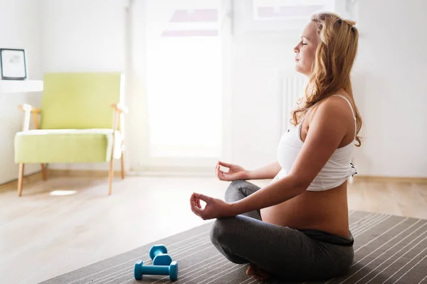 Pregnant woman in lotus posture