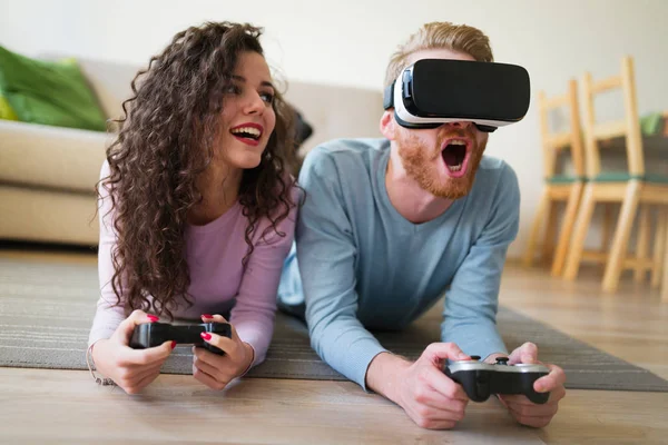 Couple having fun playing with VR