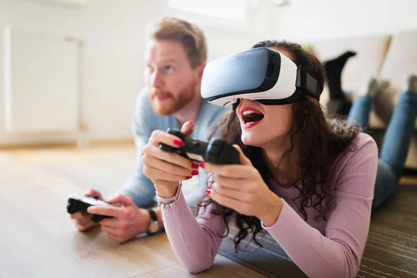 Couple enjoying VR and playing games