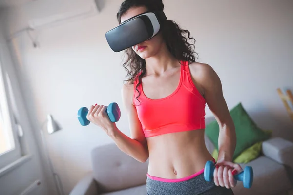 A Man Lifting Dumbbell while Wearing Virtual Goggles · Free Stock