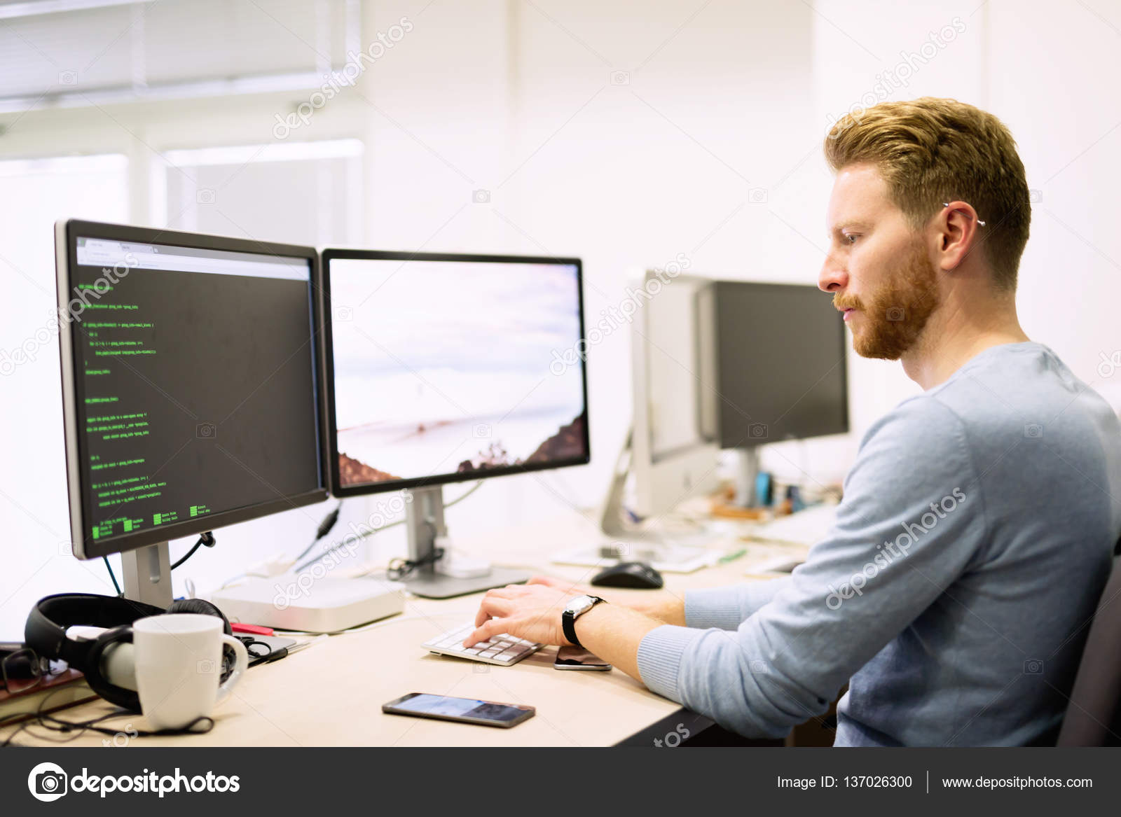 Programmer working in a software developing company Stock Photo by ©nd3000  137026300