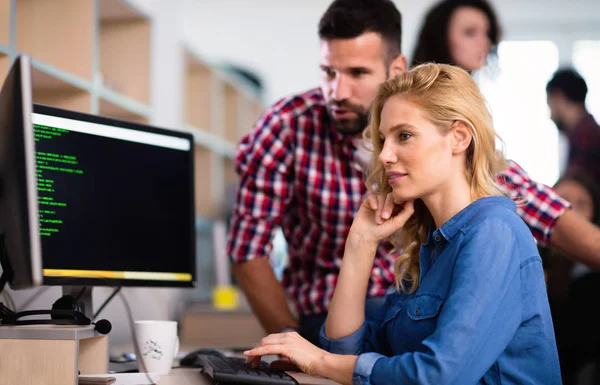 Programmers cooperating at  company — Stock Photo, Image