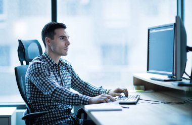 Professional software developer working in office