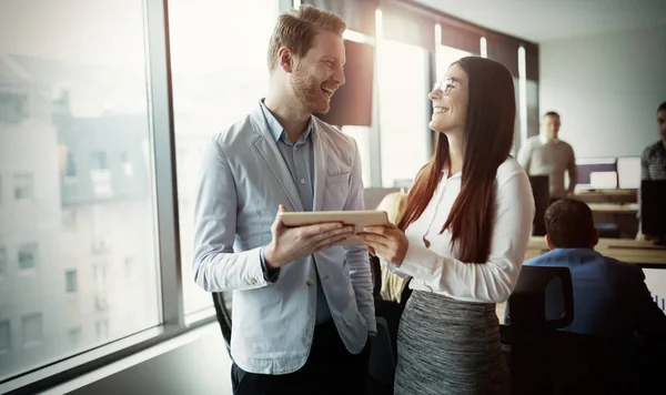 Happy cheerful business colleagues in office