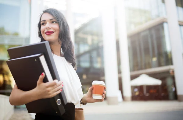 businesswoman near office building