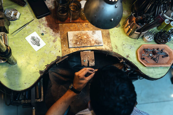 Goldsmith working on his bench