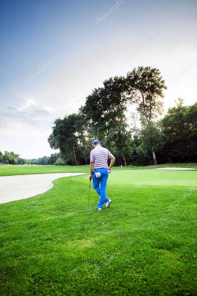 beautiful scenery with golfer