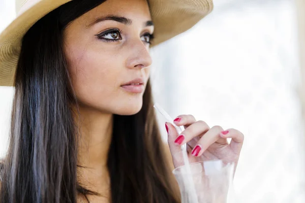 Relaxed woman drinking beverage — Stock Photo, Image