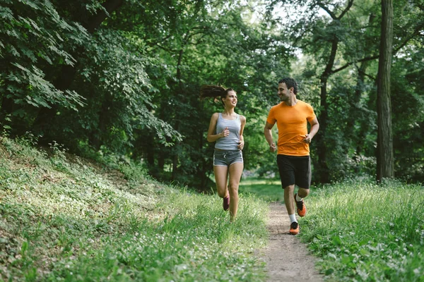 Couple jogging outdoors — Stock Photo, Image