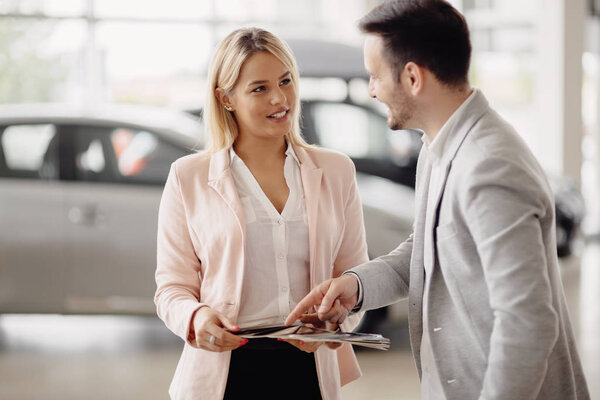 Salesperson at car dealership