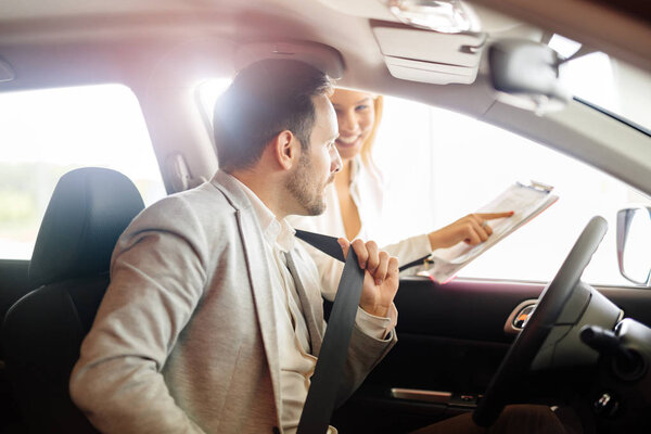 Professional salesperson selling cars 