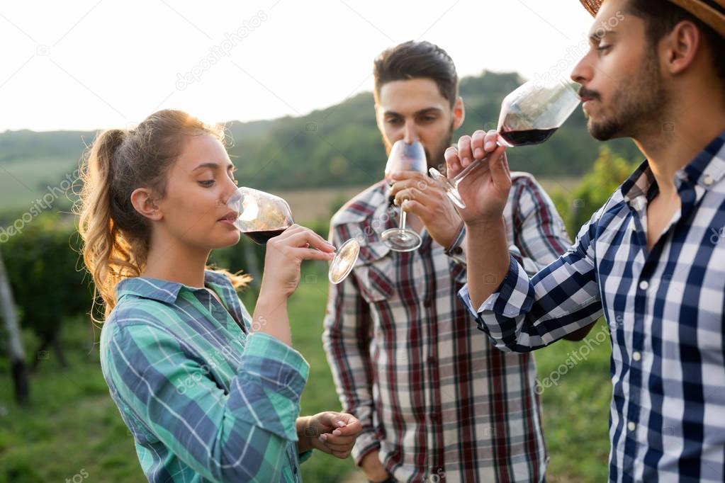People tasting wine