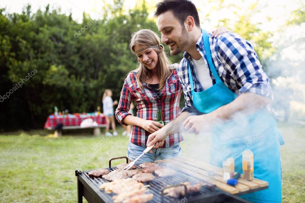 Happy people enjoying bbq