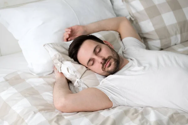 Handsome male sleeping in bed — Stock Photo, Image