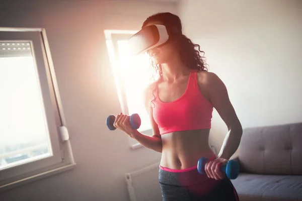 Woman working out with VR headset — Stock Photo, Image