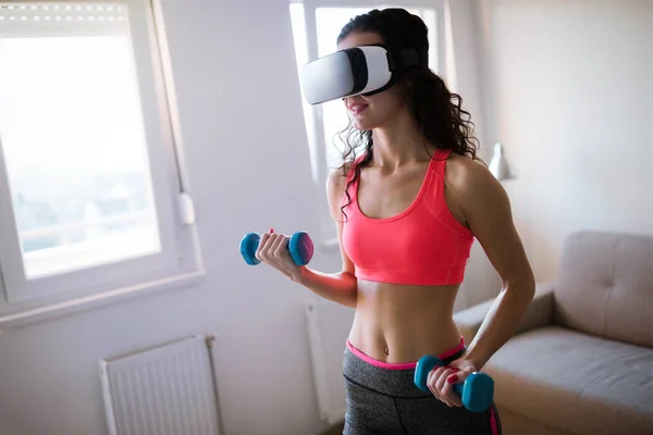 woman working out with VR headset