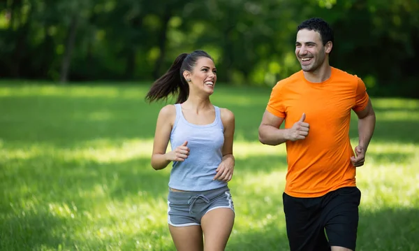 Happy couple running together — Stock Photo, Image