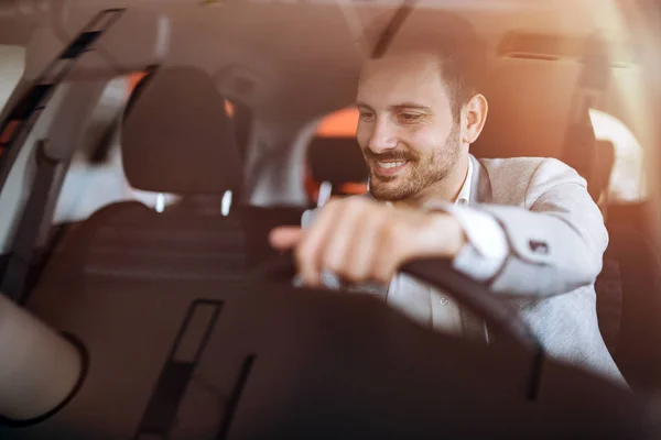 Handsome businessman driving car — Stock Photo, Image
