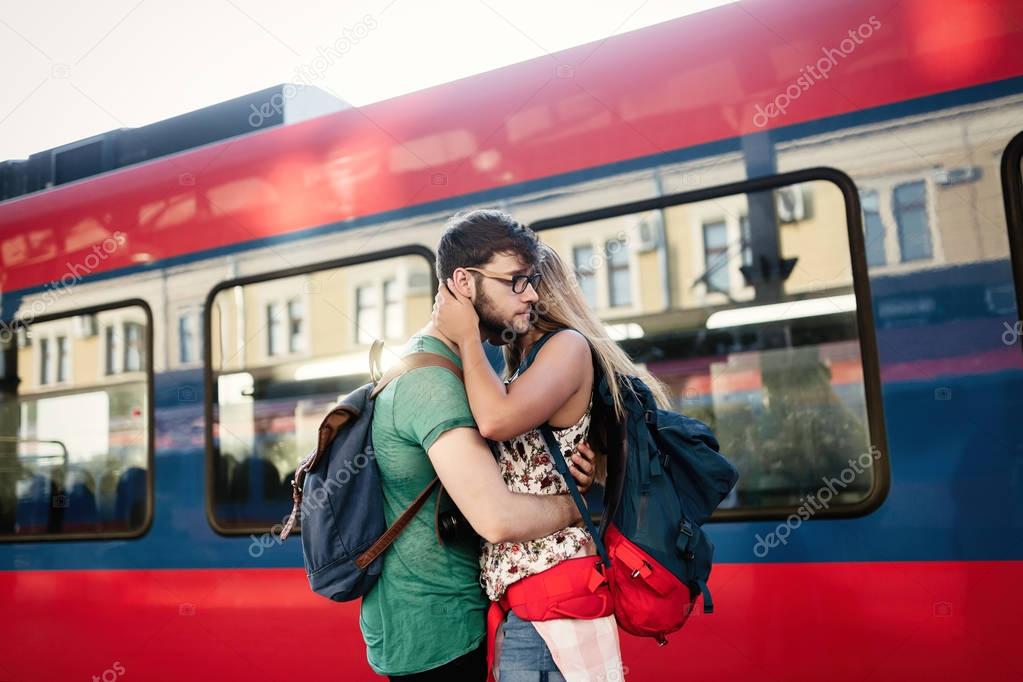 Couple separating for time at train station