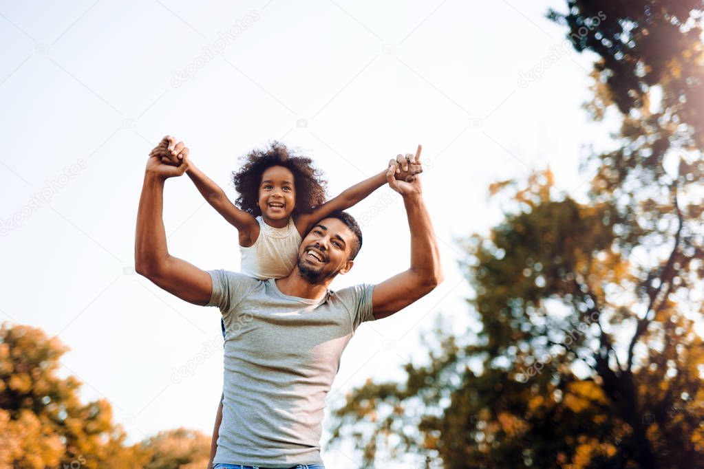 father and child spending time outdoors