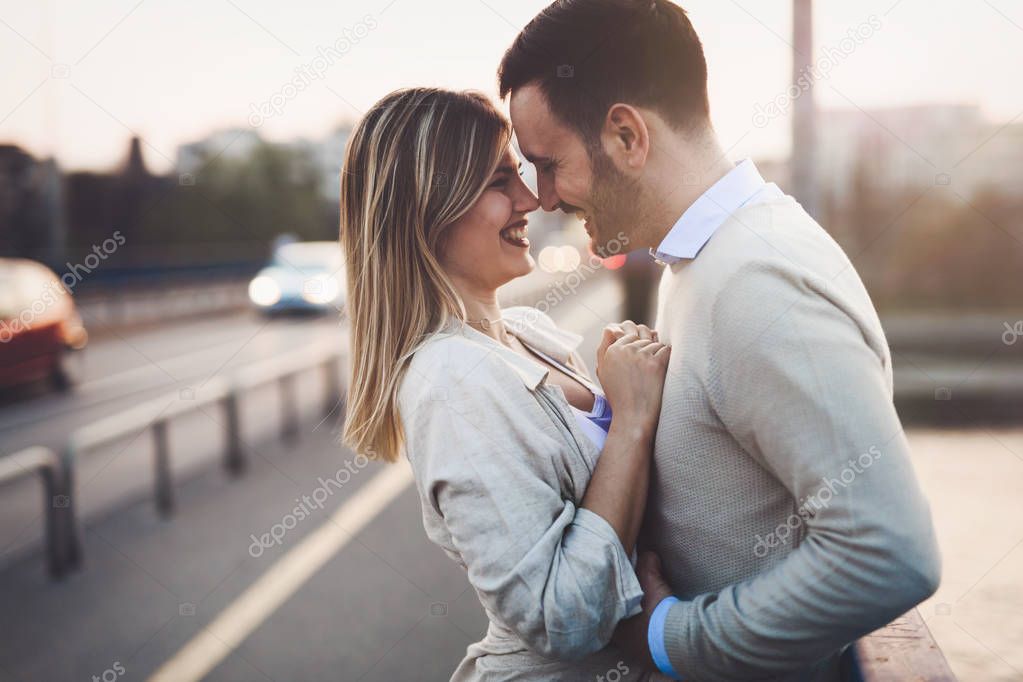 Happy romantic couple hugging and smiling