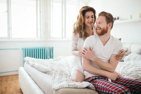 Romantic couple in bedroom — Stock Photo, Image