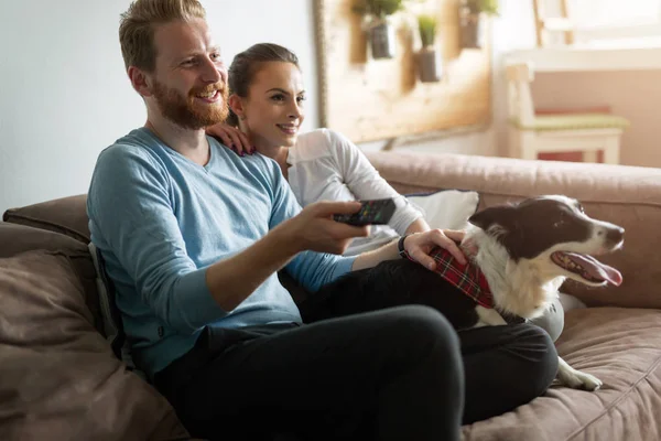 Couple relaxing with their dog — Stock Photo, Image