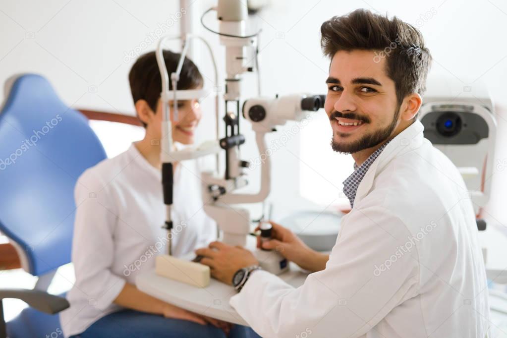 optometrist checking patient eyesight