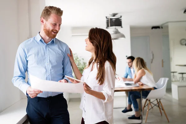 Group of young business people and architects working on project — Stock Photo, Image