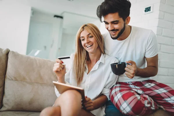 Young attractive couple spending time together at home — Stock Photo, Image