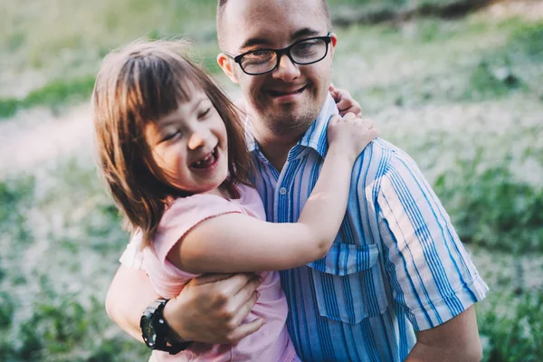 Picture of girl and man with down syndrome — Stock Photo, Image