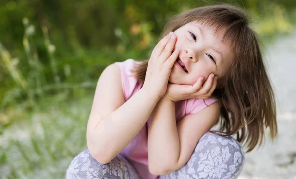 Portrait of young girl with down syndrome — Stock Photo, Image