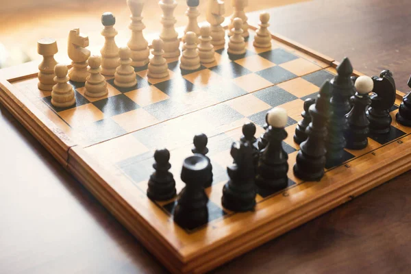 Chess board with chess wooden pieces isolated on white — Stock Photo, Image