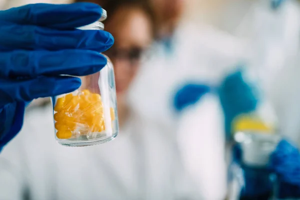 Close-up picture of pills in small bottle — Stock Photo, Image