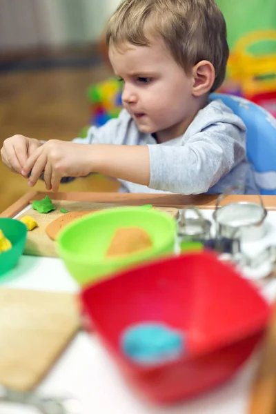 Kid playing with playdough — Stock Photo, Image