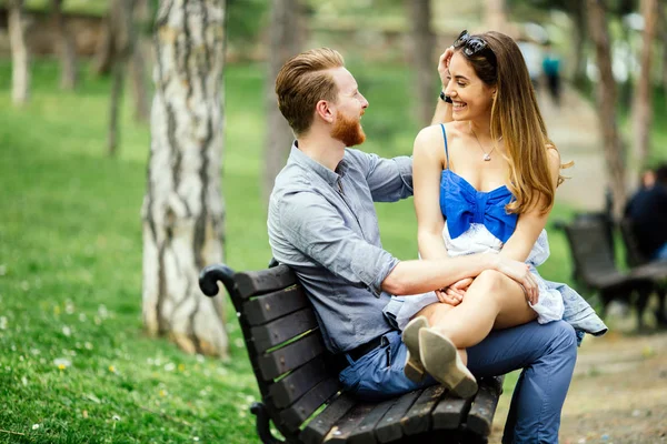 Romantic couple in love on bench — Stock Photo, Image