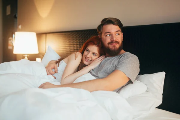 cute young couple in bed