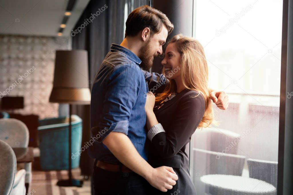 Happy passionate couple hugging